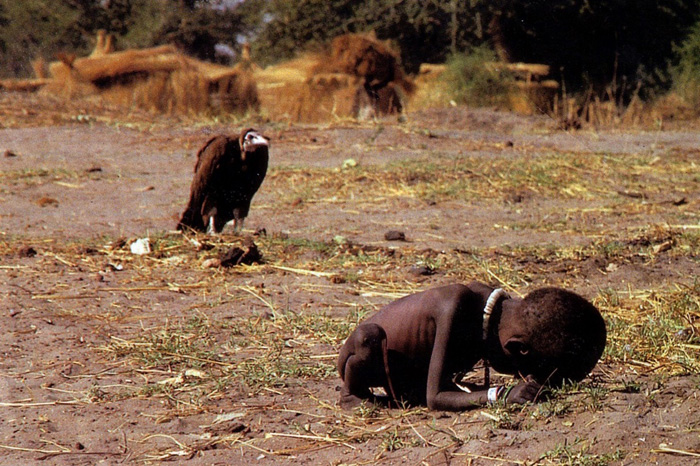 Vulture stalking a child