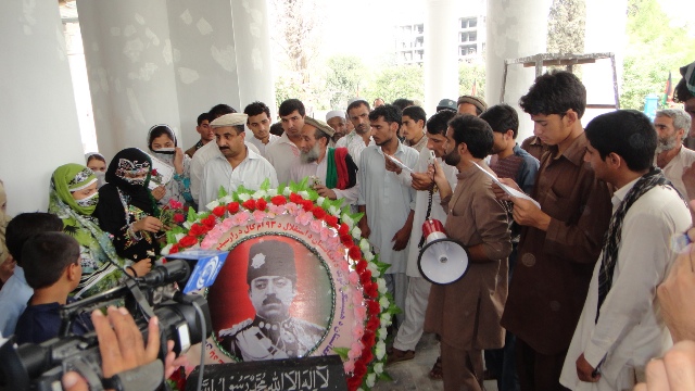 Members of the Solidarity Party of Afghanistan place flowers on the tomb of King Amanullah Khan in Jalalabad